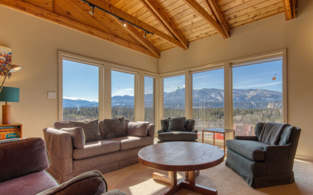Hot tub with clear water on deck with 2 sun loungers
