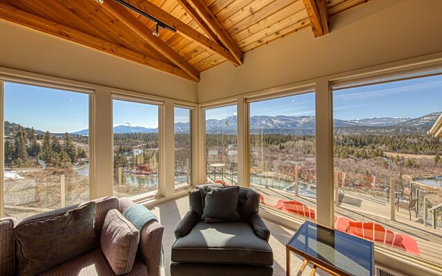 Hot tub with clear water on deck with 2 sun loungers