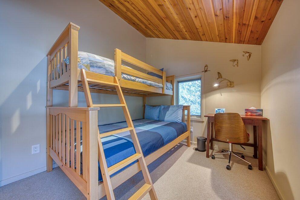 Work station and twin over double bunk in upper level bedroom