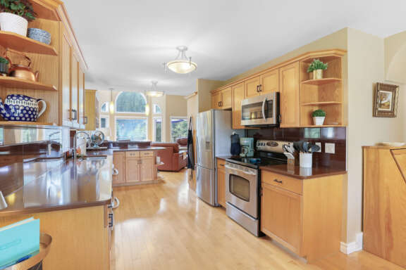 Galley kitchen, fully stocked with appliances