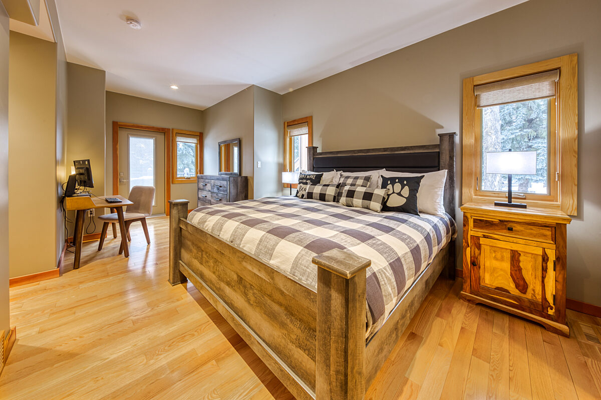 Master bedroom - main floor with king bed, workstation, ensuite shower-room