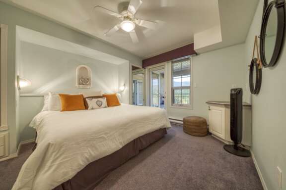 One bedroom with King bed, lots of storage and a walk-out deck