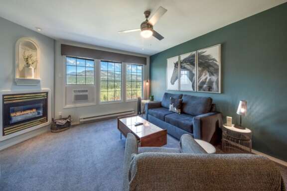 Living area with gas fireplace and AC