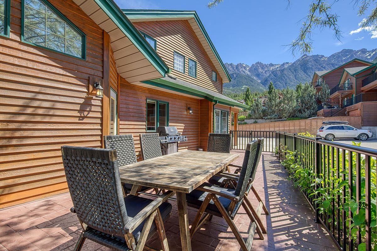 Wrap around deck with BBQ and outdoor dining spaces