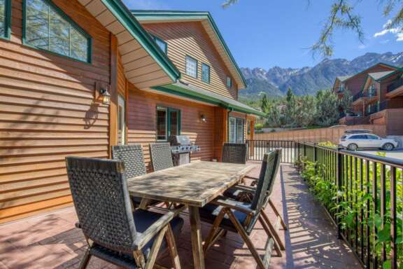 Wrap around deck with BBQ and outdoor dining spaces