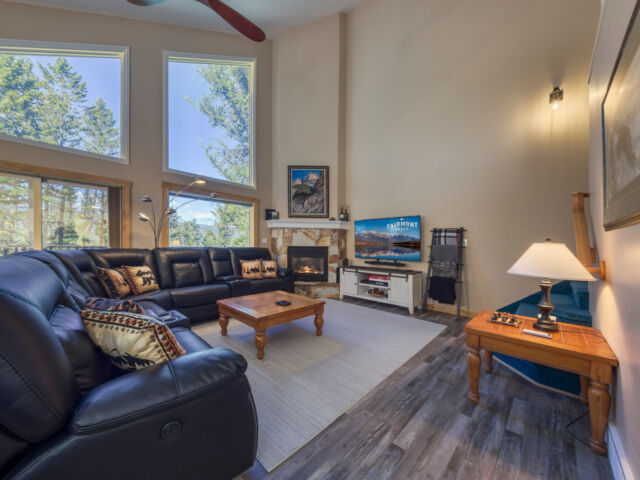 Cozy living room with Smart TV, gas fireplace and games