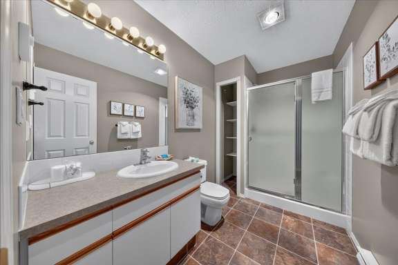 Lower-level bathroom 3 with a vanity, walk in shower and toilet at Springs & Swings - Marble Canyon 504 - Phase 1.
