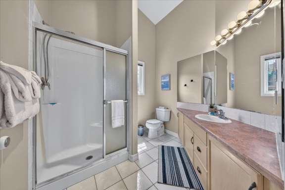 Full bathroom with walk-in shower and single vanity at Marble Canyon 704 Phase 2 in Fairmont Hot Springs.
