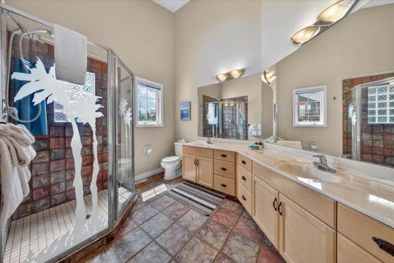 Ensuite shower room connected to the master bedroom with walk-in shower and double vanity at Marble Canyon 704 Phase 2 in Fairmont Hot Springs.