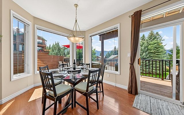 Exterior of Marble Canyon 704 Phase 2 showcasing the large deck, private balconies, and stunning mountain views in Fairmont Hot Springs.