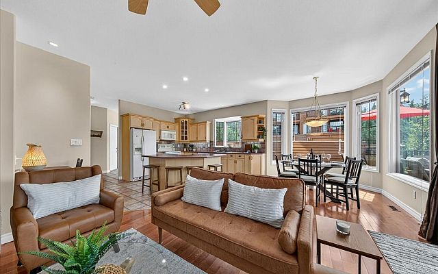 Exterior of Marble Canyon 704 Phase 2 showcasing the large deck, private balconies, and stunning mountain views in Fairmont Hot Springs.