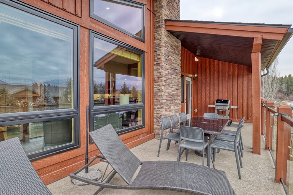Partially covered deck with BBQ, dining area and sun loungers