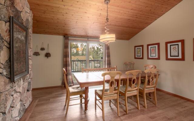 Large cabin with open concept. Surrounded by greenery and trees.