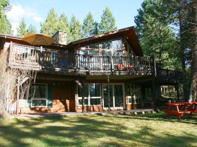 Large cabin with open concept. Surrounded by greenery and trees.