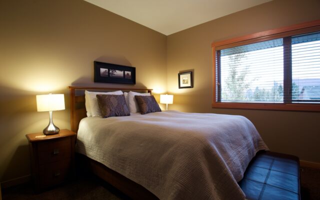 Spacious kitchen with black cabinets, stainless steel appliances, and counterspace.