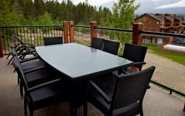 Spacious kitchen with black cabinets, stainless steel appliances, and counterspace.