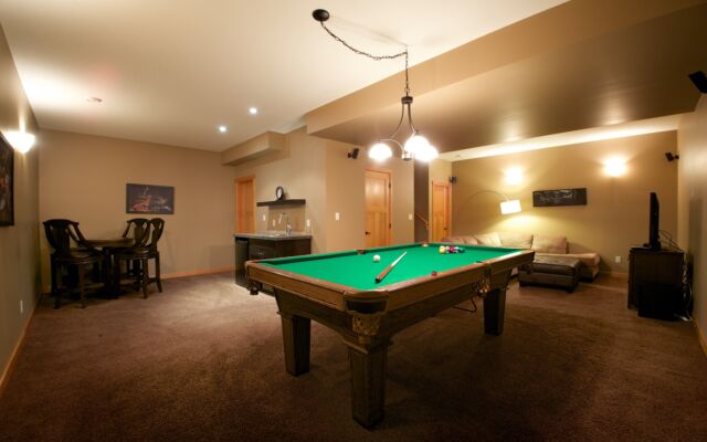 Spacious kitchen with black cabinets, stainless steel appliances, and counterspace.