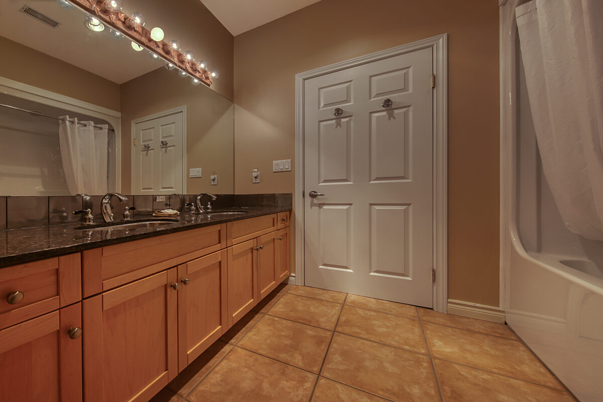 Bathroom with vanity and shower.