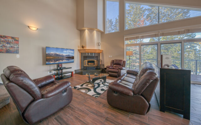 Kitchen area with modern appliances, cooking space, and windows.