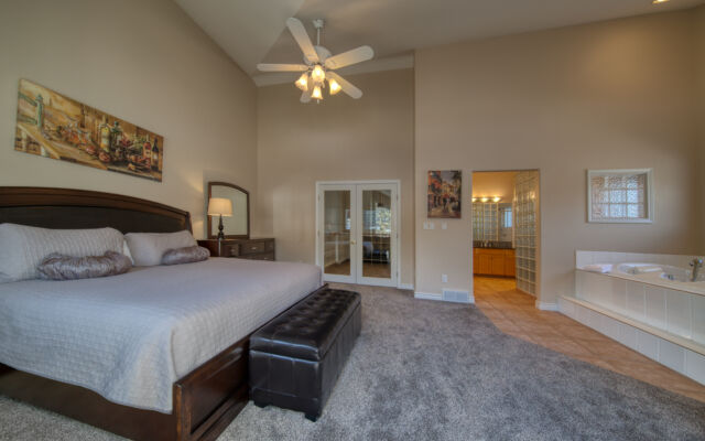 Kitchen area with modern appliances, cooking space, and windows.