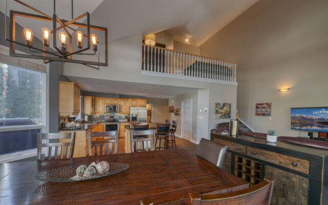 Kitchen area with modern appliances, cooking space, and windows.
