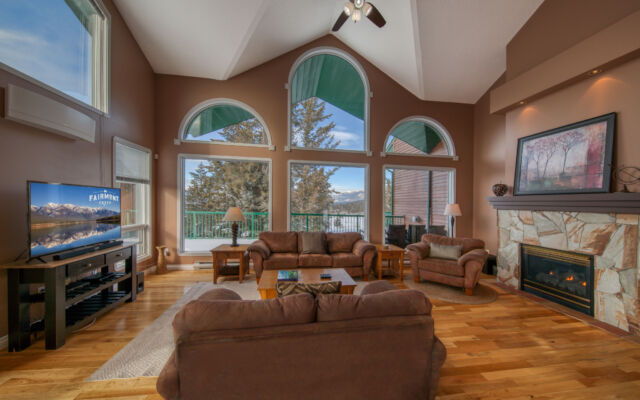Dining area with large windows. Dining table and chairs.