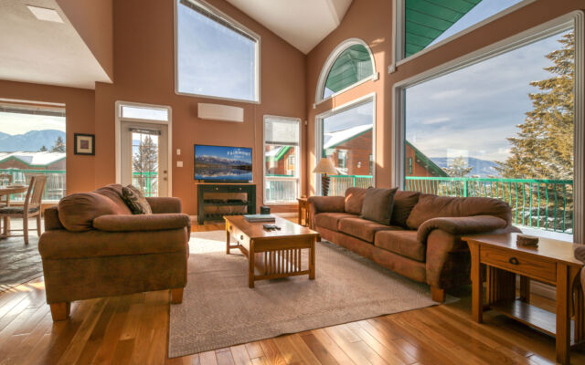 Dining area with large windows. Dining table and chairs.