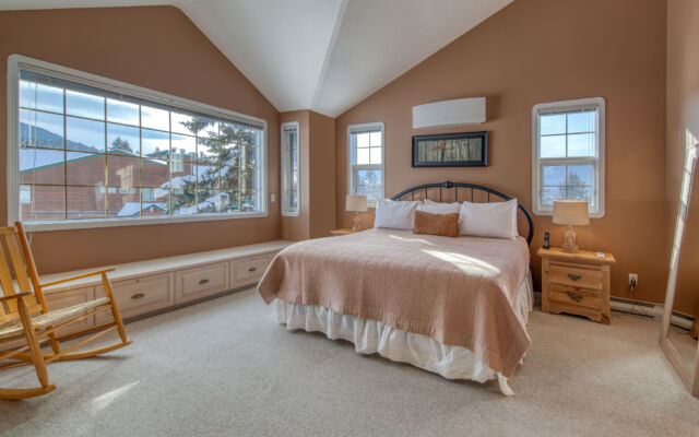 Dining area with large windows. Dining table and chairs.