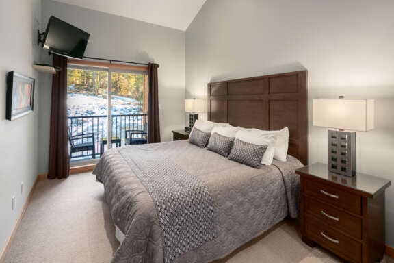 Master bedroom with walk-out patio. Outdoor furniture on patio