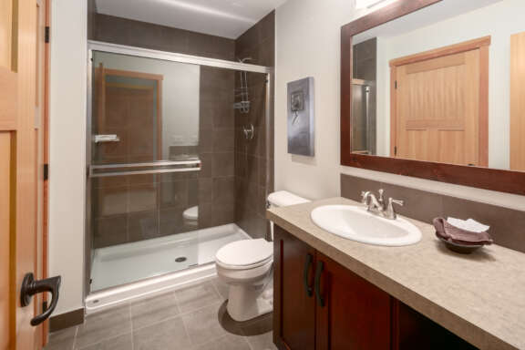 Bathroom with shower, bathtub, vanity, and toilet.
