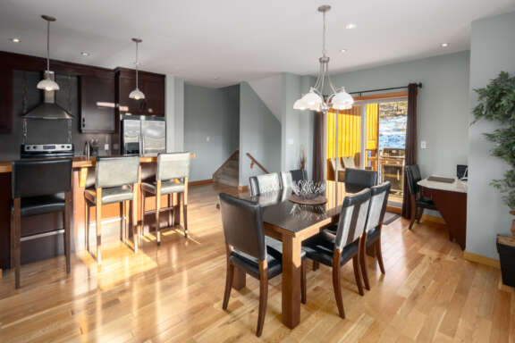 Spacious kitchen area with seating, barstools,