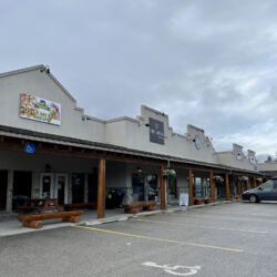 A car parked in front of a restaurant.
