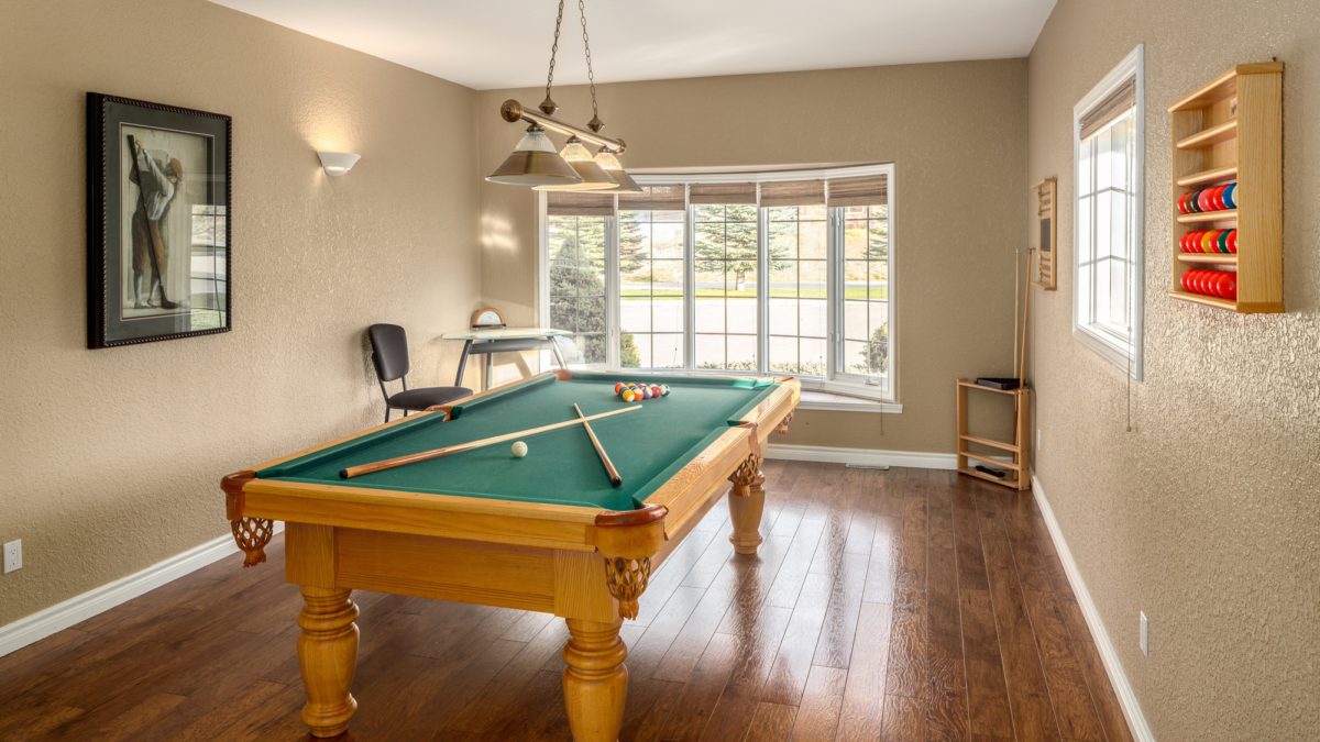 Recreation room with pool table and window to the rear
