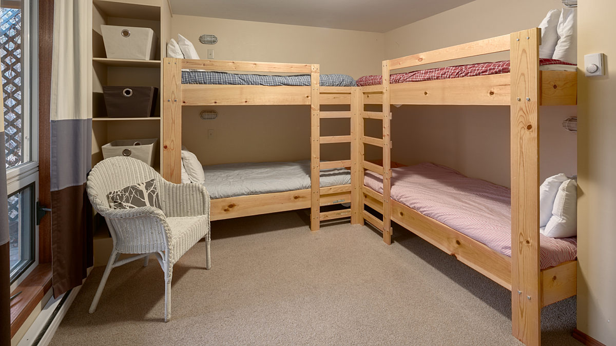 Bedroom with four bunk beds.